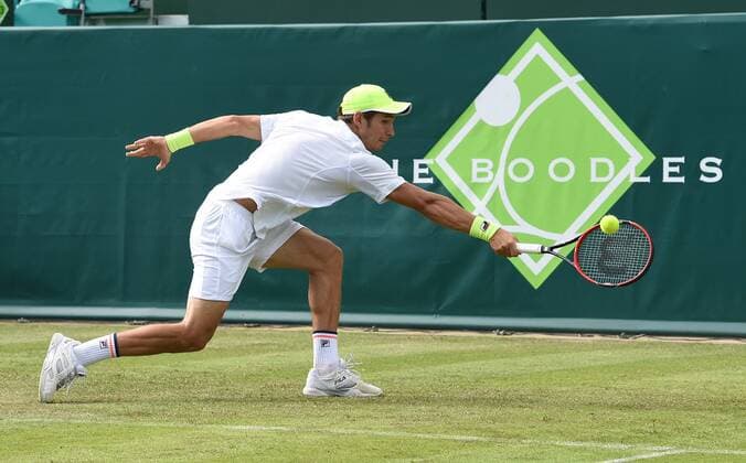 23.06.2015. Slough, England. The Boodles Tennis Tournament. Dusan Lajovic (SRB) stretches for his backhand xJonxBromleyx  ActionPlus11634627