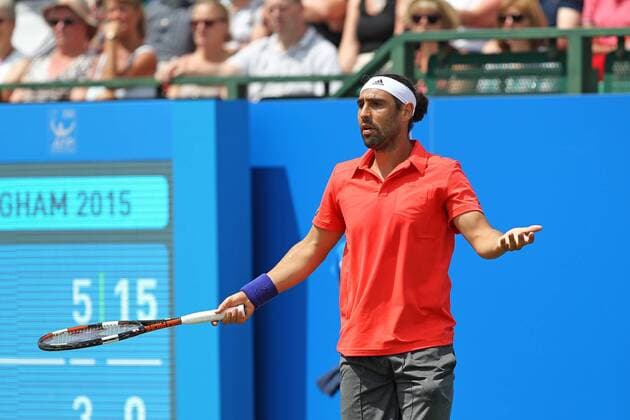 24.06.2015. Nottingham, England. Aegon Nottingham Open Tennis Tournament. Marcos Baghdatis (Cyprus) challenges a line call as he progresses to the quarter finals after his defeat of Alexander Zverev (Germany) xDavidxKissmanx  ActionPlus11634786