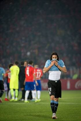 SANTIAGO, 2015 -- Edinson Cavani (Front) of Uruguay reacts after receiving a red card from the umpire during their quarterfinal against Chile at 2015 Copa America in Santiago, Chile, on June 24, 2015. Uruguay lost the match 0-1. ) (SP)CHILE-SANTIAGO-COPA AMERICA-CHILE VS URUGUAY PedroxMera 