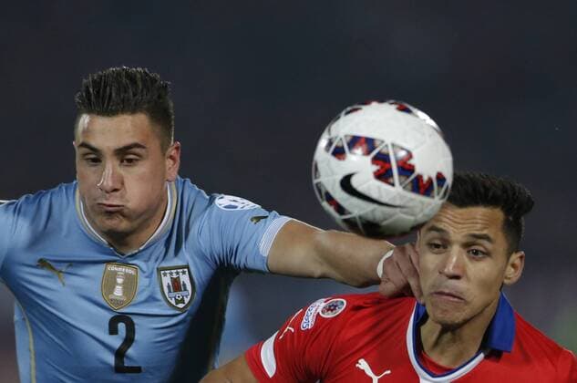 SANTIAGO, 2015 -- Alexis Sanchez (R) of Chile vies with Jose Gimenez of Uruguay during their quarterfinal at 2015 Copa America in Santiago, Chile, on June 24, 2015. Chile won 1-0. ) (SP)CHILE-SANTIAGO-COPA AMERICA-CHILE VS URUGUAY JorgexVillegas 