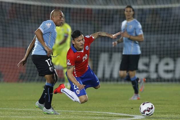 Copa America 2015 . Chile s Charles Aranguiz, right , battles for the ball against Egidio Arevalo of Uruguay during the match of quarter finals of the 2015 Copa America at La Serena stadium. Santiago, Chile. 24 06 2015 Marcelo Hernandez Photosport Chile v Uruguay, Copa America 2015. 