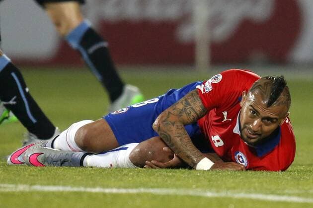 Chile v Uruguay. Copa America Championship 2015 . Chile s player, Arturo Vidal, reacts suffering a fault during the group A of the 2015 Copa America football match against Uruguay at the National stadium in Santiago, Chile. 24 06 2015 Andres Pina Photosport Chile v Uruguay, Copa America 2015. 