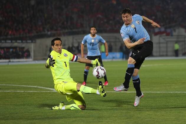 Chile v Uruguay. Copa America Championship 2015 . Chile s goalkeeper Claudio Bravo, left, battles for the ball against Cristian Rodriguez of Uruguay during the group A of the 2015 Copa America football match at the National stadium in Santiago, Chile. 24 06 2015 Fotoarena Photosport Chile v Uruguay, Copa America 2015. 