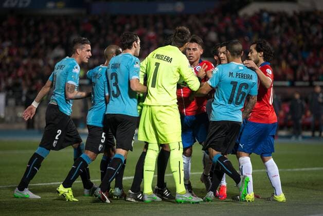 Chile v Uruguay. Copa America Championship 2015 . Chile s player Eduardo Vargas, right, and goalkeeper Uruguay Fernando Muslera in action during the group A of the 2015 Copa America football match at the National stadium in Santiago, Chile. 24 06 2015 Fotoarena Photosport Chile v Uruguay, Copa America 2015. 