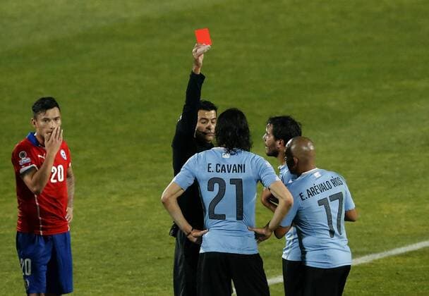 Chile v Uruguay. Copa America 2015 . The referee Sandro Ricci shows red card to Uruguay s Edinson Cavani during the 2015 Copa America football match held at the Nacional stadium in Santiago, Chile. 24 06 2015 Martin Thomas Photosport Chile v Uruguay, Copa America 2015. 