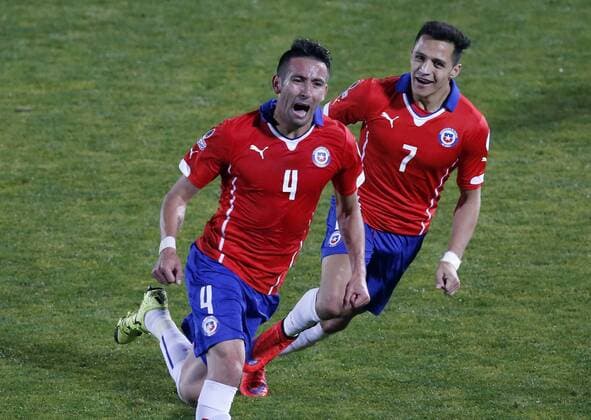 Chile s player Mauricio Isla celebrates with teammates scoring against Uruguay during the 2015 Copa America football match held at the Nacional stadium in Santiago, Chile. 24 06 2015 Martin Thomas Photosport Chile v Uruguay, Copa America 2015. 