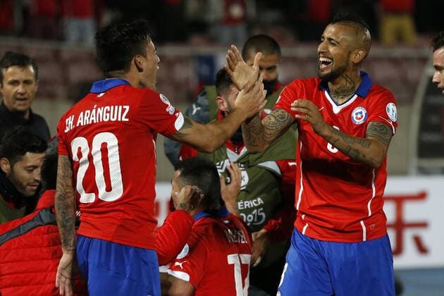 Chile s players Charles Aranguiz, left, and Arturo Vidal celebrate the goal against Uruguay during the group A of the 2015 Copa America football match at the National stadium in Santiago, Chile. 24 06 2015 Andres Pina Photosport Chile v Uruguay, Copa America 2015. 