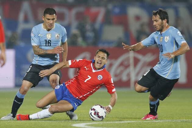 Chile s Alexis Sanchez , left , battles for the ball against Alvaro Gonzalez of Uruguay during the match of quarter finals of the 2015 Copa America at La Serena stadium. Santiago, Chile. 24 06 2015 Marcelo Hernandez Photosport Chile v Uruguay, Copa America 2015. 