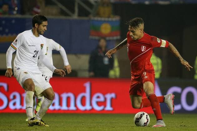 Football, Bolivia v Peru Copa America 2015. Peru s player Paolo Guerrero, right, battles for the ball against Cristhian Coimbra of Bolivia during the finals quarters for Copa America, at Bicentenario German Becker stadium. Temuco, Chile. 26 06 2015 Dragomir Yankovic Photosport Bolivia v Peru, Copa America 2015. 