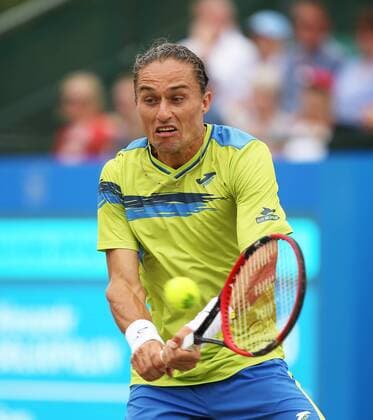Aktuell Tennis, ATP Turnier in Nottingham 26.06.2015. Nottingham, England. Aegon Nottingham Open Tennis Tournament. Backhand from Alexander Dolgopolov (UKR) in his semi final match against Sam Querrey (USA) xDavidxKissmanx  ActionPlus11635243
