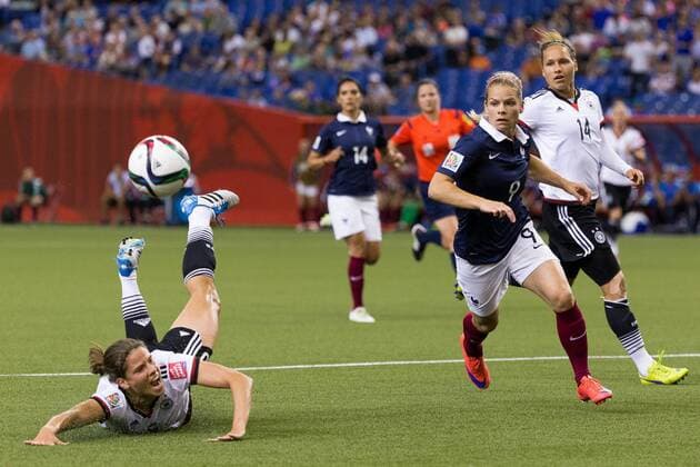 June 26, 2015 : France forward Eugenie Le Sommer 9 chases the ball as Germany defender Annike Krahn 5 falls on the ground during the 2015 FIFA Women s World Cup Quarter final match between Germany and France at the Olympic Stadium in Montreal, Quebec, Canada. SOCCER: JUN 26 FIFA Women s World Cup - Quarter-Final - Germany v France Icon15062607 EDITORIAL USE ONLY