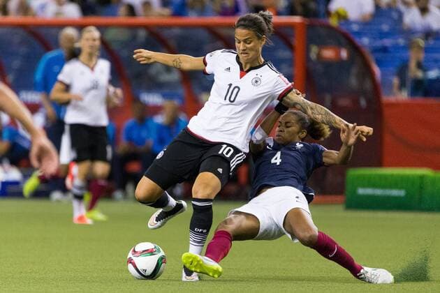 June 26, 2015 : France defender Laura Georges 4 tackles Germany midfielder Dzsenifer Marozsan 10 during the 2015 FIFA Women s World Cup Quarter final match between Germany and France at the Olympic Stadium in Montreal, Quebec, Canada. SOCCER: JUN 26 FIFA Women s World Cup - Quarter-Final - Germany v France Icon15062619 EDITORIAL USE ONLY