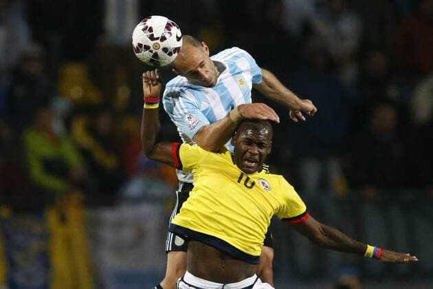 Football , Argentina v Colombia. Copa America Championship 2015 . Argentina s player Pablo Zabaleta, top, battles for the ball against Víctor Ibardo of Colombia during the 2015 Copa America football championship quarterfinal match at the Sausalito stadium in Vina del Mar, Chile. 26 06 2015 AndresxPina Photosport Argentina v Colombia, Copa America 2015. 