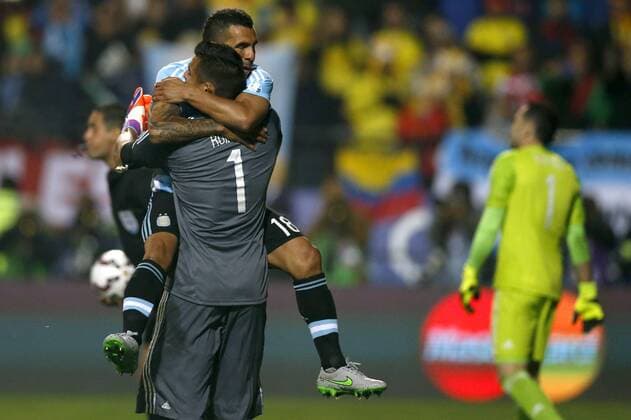 Football , Argentina v Colombia. Copa America Championship 2015 . Argentina s player Carlos Tevez, top, celebrates with Sergio Romero scoring against Colombia during the 2015 Copa America football championship quarterfinal match at the Sausalito stadium in Vina del Mar, Chile. 26 06 2015 AndresxPina Photosport Argentina v Colombia, Copa America 2015. 