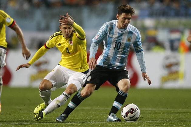 Football , Argentina v Colombia. Copa America Championship 2015 . Argentina s player Lionel Messi, right, battles for the ball against Santiago Arias of Colombia during the 2015 Copa America football championship quarterfinal match at the Sausalito stadium in Vina del Mar, Chile. 26 06 2015 AndresxPina Photosport Argentina v Colombia, Copa America 2015. 