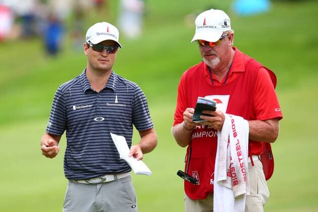 June 27, 2015 - Cromwell, Connecticut, U.S - Zach Johnson and caddy on the 18th green during the third round of the Travelers Championship at TPC River Highlands in Cromwell, Connecticut. Golf 2015 - Travelers Championship - Round 3 - ZUMAc119
