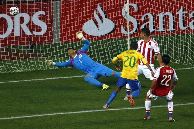 Football , Brazil v Paraguay. Copa America Championship 2015 . Brazil player Robinho, center, scores his goal against Paraguay during the 2015 Copa America football championship quarterfinal match at the Ester Roa stadium in Concepcion, Chile. 27 06 2015 Adrian Aylwin Photosport Brasil v Paraguay, Copa America 2015. 