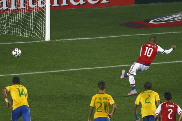 Football , Brazil v Paraguay. Copa America Championship 2015 . Paraguay player Derlis Gonzalez, right, scores his goal against Brazil during the 2015 Copa America football championship quarterfinal match at the Ester Roa stadium in Concepcion, Chile. 27 06 2015 Adrian Aylwin Photosport Brasil v Paraguay, Copa America 2015. 
