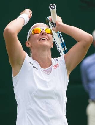 - LONDON, UNITED KINGDOM: Belgian Kirsten Flipkens jubilates after winning the first round match between Belgian Kirsten Flipkens and German Annika Beck at the 2015 Wimbledon grand slam tennis tournament at the All England Tennis Club, in southwest London, Britain, Monday 29 June 2015. BENOITxDOPPAGNE  x04653680x