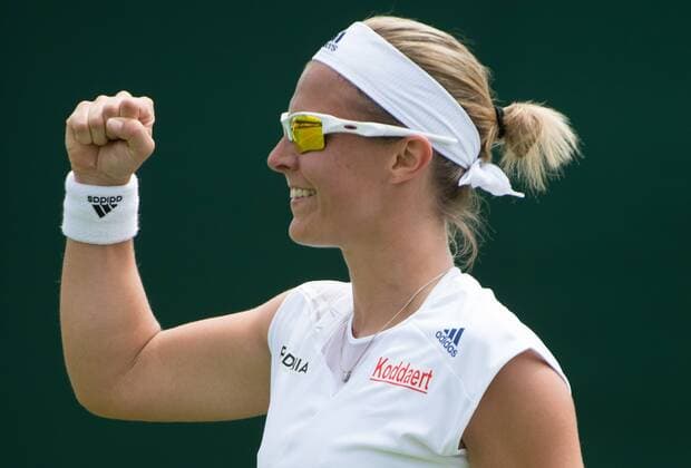 - LONDON, UNITED KINGDOM: Belgian Kirsten Flipkens jubilates after winning the first round match between Belgian Kirsten Flipkens and German Annika Beck at the 2015 Wimbledon grand slam tennis tournament at the All England Tennis Club, in southwest London, Britain, Monday 29 June 2015. BENOITxDOPPAGNE  x04653683x