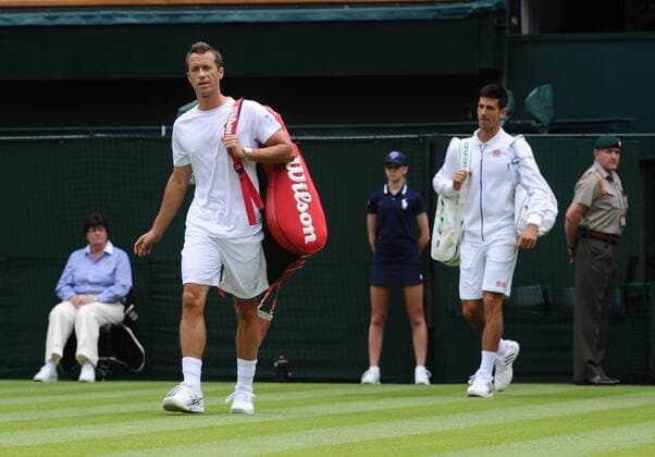 Tennis - 2015 Wimbledon Championships - Week One, Monday Men s Singles, First Round Novak Djokovic (SRB) vs. Philipp Kohlschreiber (GER) Philipp Kohlschreiber walks out onto Centre Court ahead of Djokovic. COLORSPORT ANDREW COWIE 