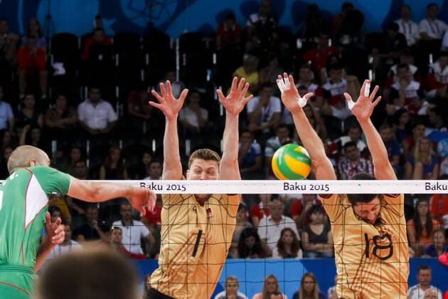 June 28, 2015 - Baku, Azerbaijan - Michael ANDREI (18) and Christian FROMM (1) of Germany are jumping on the net on the hit of Valentin BRATOEV(10) of Bulgaria in the match Germany -Bulgaria during the final for gold at Baku 2015 European Games at the Crystal Hall on June 28, 2015 in Baku, Azerbaijan. Baku 2015: Volleyball - Men s Volleyball final  - ZUMAn230