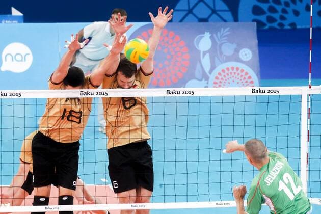 June 28, 2015 - Baku, Azerbaijan - Michael ANDREI (18) and Denys KALIBERDA (6) of Germany are jumping on the net on the hit of Jani JELIAZKOV (12) of Bulgaria in the match Germany -Bulgaria during the final for gold at Baku 2015 European Games at the Crystal Hall on June 28, 2015 in Baku, Azerbaijan. Baku 2015: Volleyball - Men s Volleyball final  - ZUMAn230