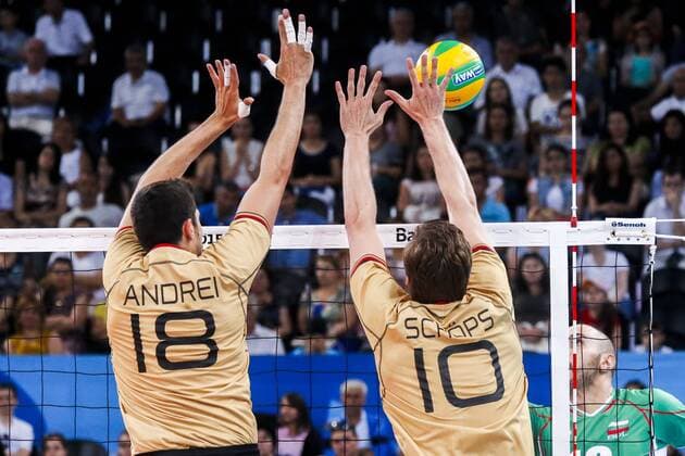 June 28, 2015 - Baku, Azerbaijan - Michael ANDREI (18) and Jochen SCHOPS (10) of Germany are jumping on the net on the hit of Valentin.BRATOEV (10) of Bulgaria in the match Germany -Bulgaria during the final for gold at Baku 2015 European Games at the Crystal Hall on June 28, 2015 in Baku, Azerbaijan. Baku 2015: Volleyball - Men s Volleyball final  - ZUMAn230