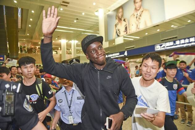 SHANGHAI, CHINA - JUNE 28: (CHINA OUT) Demba Ba arrives at Pudong International Airport on June 28, 2015 in Shanghai, China. Demba Ba will sign a three-year contract with Chinese Super League club Shanghai Greenland Shenhua.  CFP469665867 