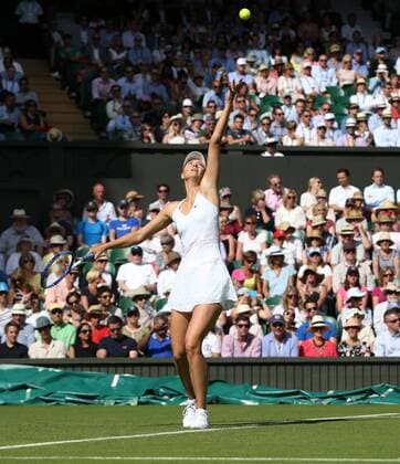 Russian Maria Sharapova serves the ball in her match against Britain s Johanna Konta on day one of the 2015 Wimbledon championships, London on June 29, 2015. Sharapova won the match 6-2, 6-2.  LON2015062943 HUGOxPHILPOTT