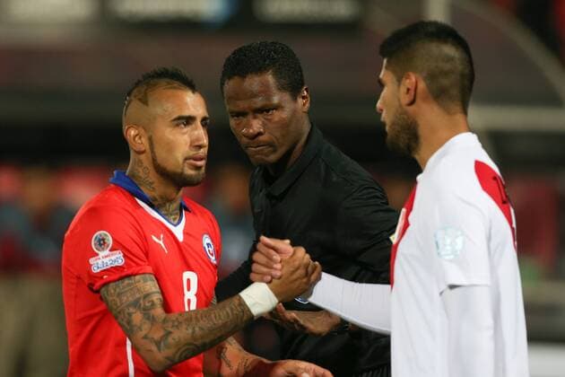 Chile x Peru SANTIAGO, CHILE - 06 29 2015: CHILE PERU X - Arturo Vidal of Chile and Carlos Zambrano of Peru during the match between Chile x Peru held at the National Stadium Julio Mart?nez Pr?danos the semifinals of the Copa America 2015 in Chile. (Photo: Carlos Ezequiel Vannoni FotoArena)  CarlosxEzequielxVannoni