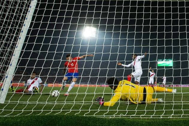Chile x Peru SANTIAGO, CHILE - 06 29 2015: CHILE PERU X - Eduardo Vargas of Chile kicks to score goal during match between Chile x Peru, valid for the semi final of the Copa America 2015 held at the National Stadium Julio Mart?nez Pr?danos. (Photo: Marcelo Machado de Melo FotoArena)  MarceloxMachadoxdexMelo