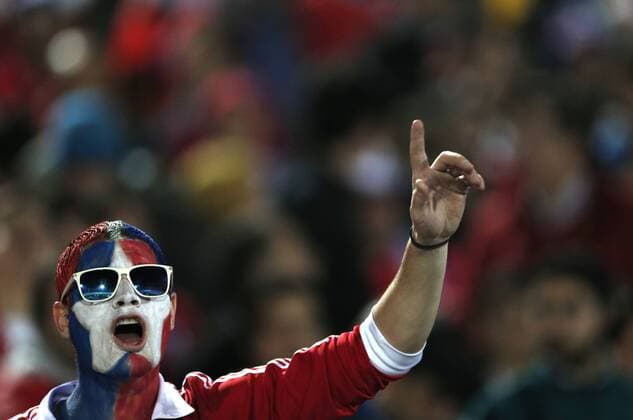 A fan from Chile reacts prior to the Copa America Chile 2015 semifinal match against Peru, held at National Stadium, in Santiago, Chile, on June 29, 2015. Chile won 2-1 ) (SP)CHILE-SANTIAGO-COPA AMERICA-CHILE VS PERU GuillermoxArias 