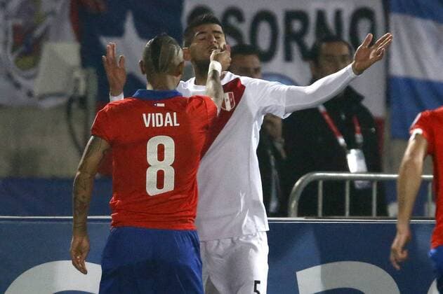 Chile s player Arturo Vidal, left, faces Carlos Zambrano of Peru during the 2015 Copa America football championship semifinal match at the National stadium in Santiago, Chile. 29 06 2015 AndresxPina Photosport Chile v Peru, Copa America 2015. 