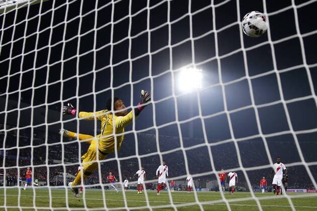 Chile s player Eduardo Vargas, left, scores against Peru during the 2015 Copa America football championship semifinal match at the National stadium in Santiago, Chile. 29 06 2015 AndresxPina Photosport Chile v Peru, Copa America 2015. 