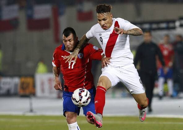 Football , Chile v Peru. Copa America 2015 . Peru s player Paolo Guerrero, right, battles for the ball against Gary Medel of Chile during the semi finals of the 2015 Copa America football match held at the Nacional stadium in Santiago, Chile. 29 06 2015 MartinxThomas Photosport Chile v Peru, Copa America 2015. 