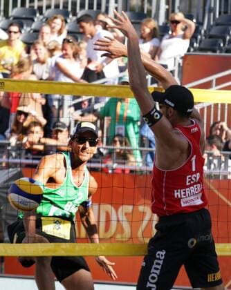 Ricardo (L) of Brazil attacks Herera (R) of Spain during the FIVB Beach volleyball Beachvolleyball World Championships male match between Brazil vs Spain at pool on June 30, 2015 in Amsterdam, Netherlands. Imago Paulo Amorim