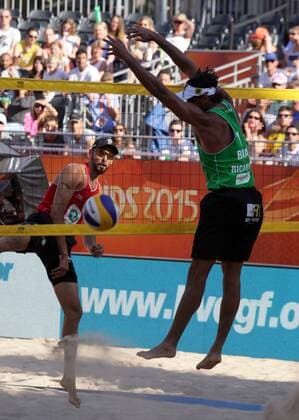 Herera (L) of Spain attacks Ricardo (R) of Brazil during the FIVB Beach volleyball Beachvolleyball World Championships male match between Brazil vs Spain at pool on June 30, 2015 in Amsterdam, Netherlands. Imago Paulo Amorim