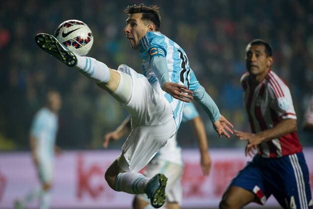 CONCEPCION, June 30, 2015 -- Lionel Messi of Argentina jumps to reach the ball during the semifinal between Argentina and Paraguay at the 2015 Copa America, in Concepcion, Chile, on June 30, 2015. Argentina won 6-1 and was qualified for the final. ) (SP)CHILE-CONCEPCION-COPA AMERICA-SEMIFINAL-ARGENTINA VS PARAGUAY PedroxMera 