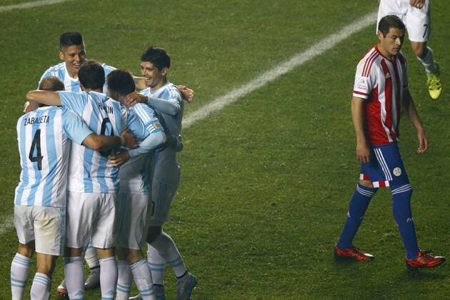 Argentina v Paraguay. Copa America Championship 2015 . Argentina s player Gonzalo Higuain, left, celebrates with teammates scoring against Paraguay during the 2015 Copa America football championship semifinal match at the Ester Roa stadium in Concepcion . 30 06 2015 Adrian Aylwin Photosport Argentina v Paraguay, Semifinal Copa America 2015. 