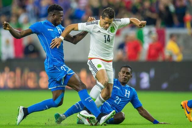 July 1, 2015: Mexico forward Javier Hernandez (14) gets fouled by Honduras defender Johnny Palacios (23) and Honduras defender Brayan Beckeles (21) during the 1st half of an international soccer match between Honduras and Mexico at NRG Stadium in Houston, TX. .. Soccer 2015: Honduras vs Mexico JUL 1 - ZUMAc04_