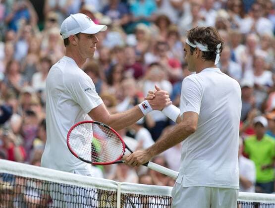L-R. Sam Querry gratuiert dem Sieger Roger Federer (SUI) Tennis - Wimbledon 2015 - Grand Slam ITF ATP Tennis Herren WTA Tennis Damen - AELTC - London - - Great Britain - 2 July 2015. Juergen Hasenkopf