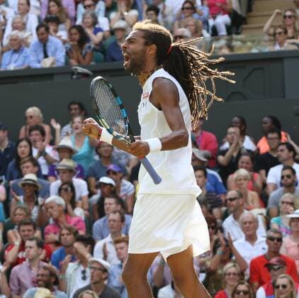 Germany s Dustin Brown celebrates after beating Spain s Rafael Nadal on day four of the 2015 Wimbledon championships, London on July 02, 2015. Brown won the match 7-5, 3-6, 6-4, 6-4.  LON20150702266 HUGOxPHILPOTT