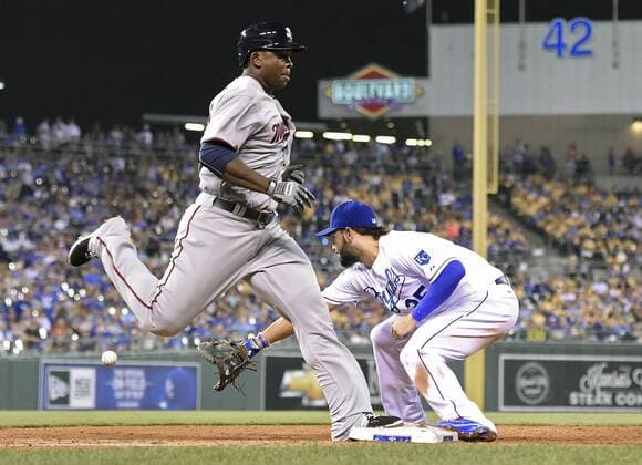 July 2, 2015 - Kansas City, MO, USA - The Minnesota Twins Miguel Sano beats out the throw to Kansas City Royals first baseman Eric Hosmer, right, for his first major league hit on a slow chopper in the ninth inning on Thursday, July 2, 2015, at Kauffman Stadium in Kansas City, Mo. The Twins won, 2-0. Minnesota at Kansas City - ZUMAm67_