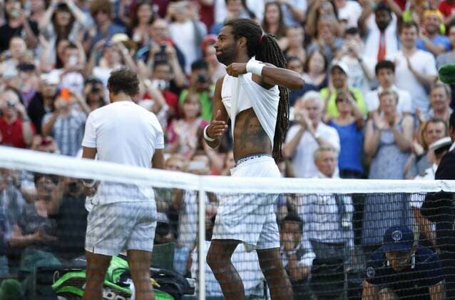 Dustin Brown of Germany celebrates during the gentlemen s second round match against Rafael Nadal of Spain at the 2015 Wimbledon Championships in Wimbledon, southwest London, July 2, 2015. Brown won the game 3-1. ) (SP)UK-WIMBLEDON-TENNIS-2015-DAY 4 YexPingfan 