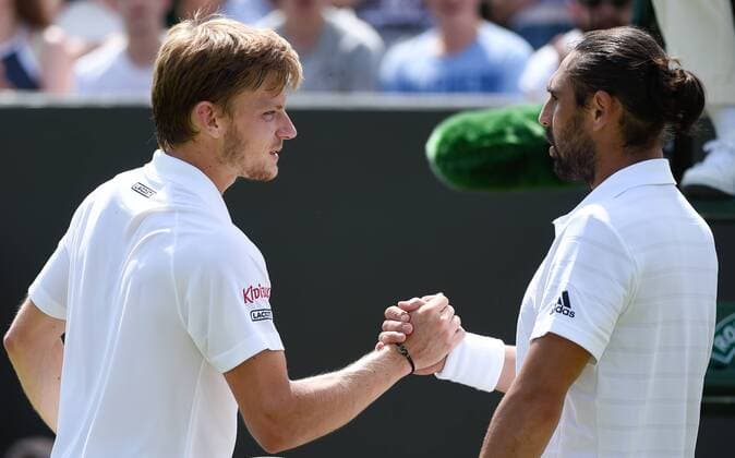 - LONDON, UNITED KINGDOM: David Goffin is congratulated by Marcos Baghdatis (R) after winning the third round of men single competition between Belgian David Goffin ATP Tennis Herren 15) and Cyprus Marcos Baghdatis (ATP 54) at the 2015 Wimbledon grand slam tennis tournament at the All England Tennis Club, in southwest London, Britain, Friday 03 July 2015. BENOITxDOPPAGNE  x04656830x