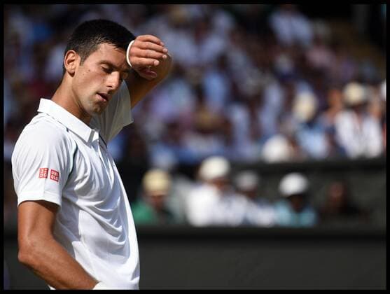 . 03 07 2015. London. Novak Djokovic playing against Bernard Tomic on centre court at Wimbledon on day 5 of the Championships.  xAndrewxParsonsx xixImagesx IIM-10679-0075