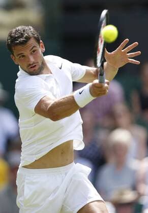 Grigor Dimitrov of Bulgaria returns the ball during the men s singles third round against Richard Gasquet of France at the 2015 Wimbledon Championships in Wimbledon, southwest London, July 3, 2015. Gasquet won 3-0. ) (SP)UK-WIMBLEDON-TENNIS-2015-DAY 5 YexPingfan 