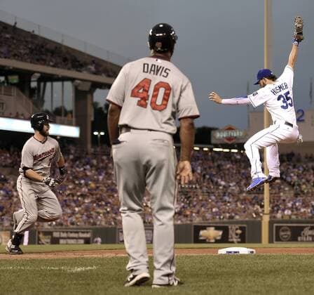 July 3, 2015 - Kansas City, MO, USA - Kansas City Royals first baseman Eric Hosmer (35) leaps to grab a throw to first as the Minnesota Twins Joe Mauer, left, reaches safely in the sixth inning on Friday, July 3, 2015, at Kauffman Stadium in Kansas City, Mo. Minnesota at Kansas City - ZUMAm67_