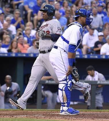 July 3, 2015 - Kansas City, MO, USA - The Minnesota Twins Miguel Sano scores behind Kansas City Royals catcher Salvador Perez on a sacrifice fly by Aaron Hicks in the fifth inning on Friday, July 3, 2015, at Kauffman Stadium in Kansas City, Mo. Minnesota at Kansas City - ZUMAm67_